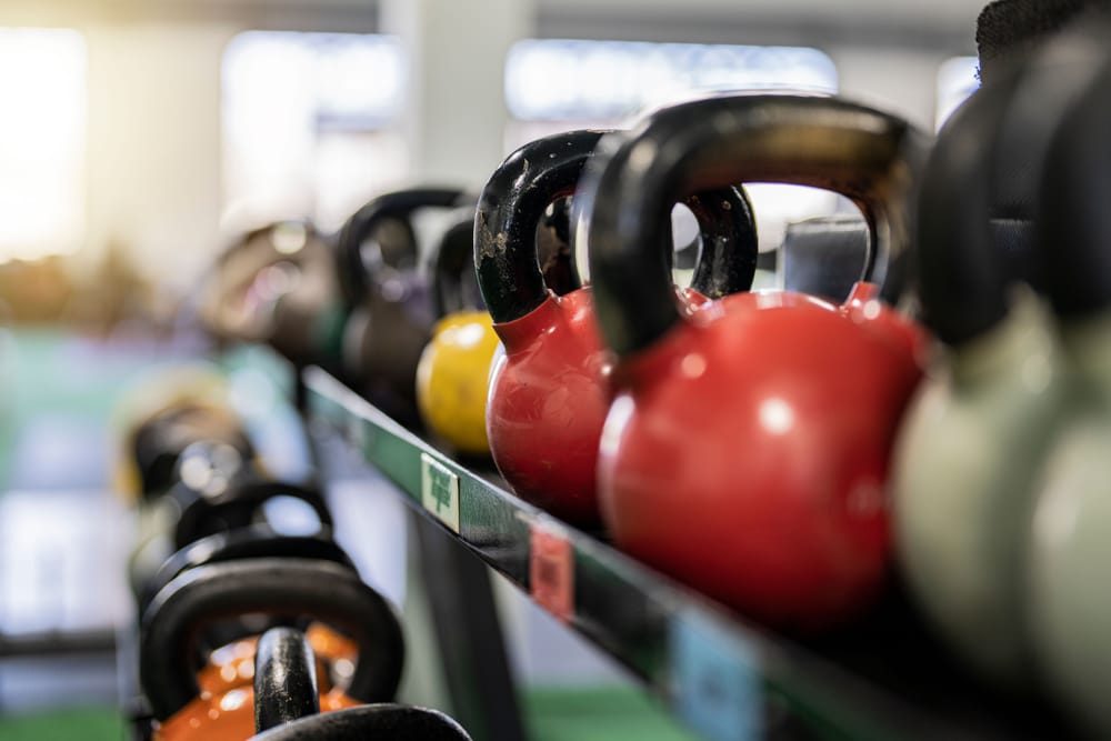 Kettlebells organised on a rack